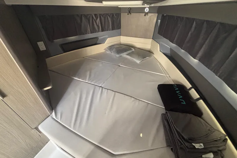  Yacht Photos Pics 2026 Navan C30 interior cabin with cozy bedding and modern design elements.