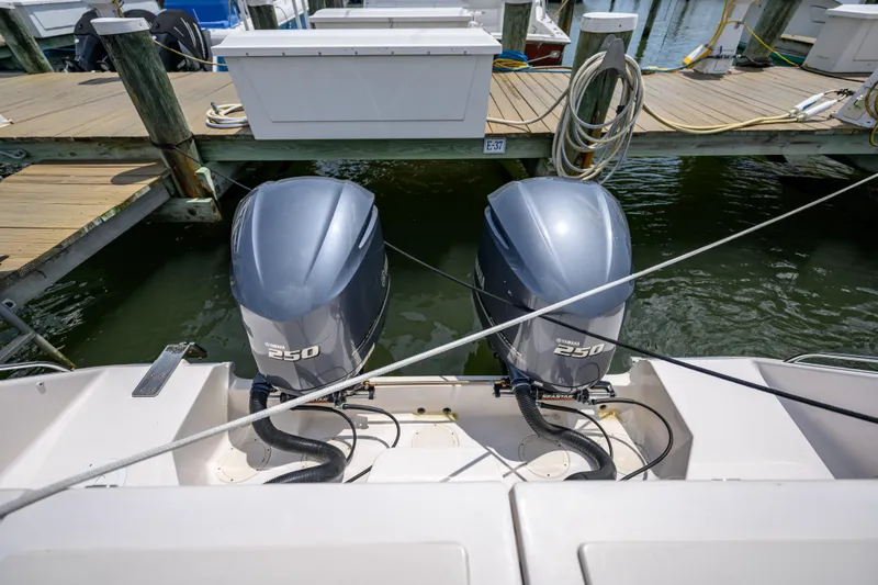 Sur Reel Yacht Photos Pics 2003 Grady-White Express 330 with twin Yamaha 250 engines docked at marina.