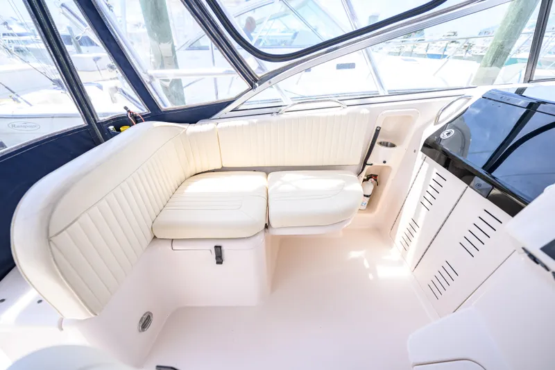 Sur Reel Yacht Photos Pics 2003 Grady-White Express 330 boat interior with white seating and modern design.