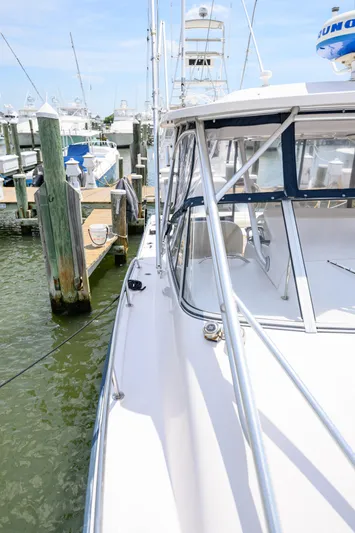Sur Reel Yacht Photos Pics 2003 Grady-White Express 330 boat docked at marina, side view.