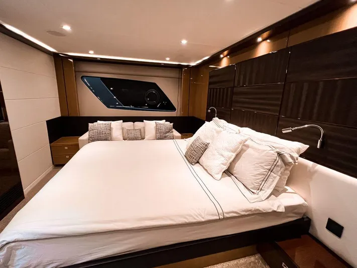 Bliss Yacht Photos Pics Luxurious bedroom interior of 2015 Princess V72 yacht with modern design and elegant bedding.