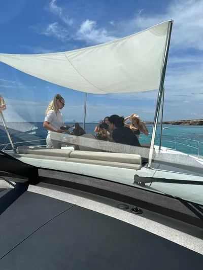 Bliss Yacht Photos Pics People enjoying a sunny day on a 2015 Princess V72 yacht.