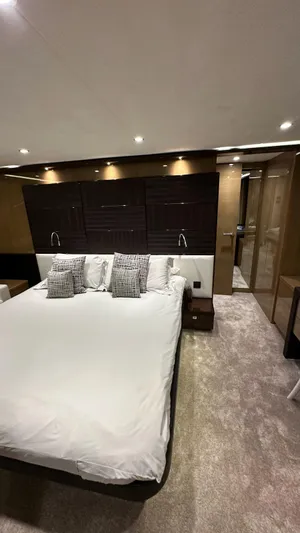 Bliss Yacht Photos Pics Luxurious bedroom interior of 2015 Princess V72 yacht with modern design and elegant lighting.