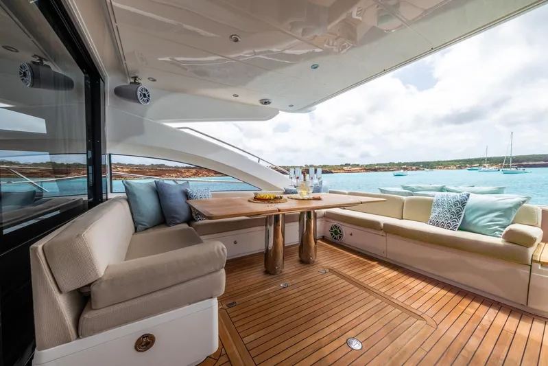 Bliss Yacht Photos Pics Luxurious 2015 Princess V72 yacht deck with elegant seating and ocean view.
