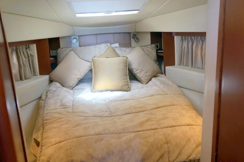 Aquaholic Yacht Photos Pics Luxurious cabin interior of 2007 Sea Ray 36 Sedan Bridge with cozy bedding.