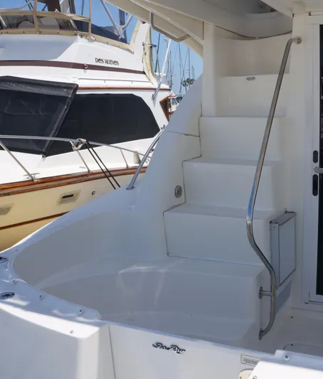 Aquaholic Yacht Photos Pics 2007 Sea Ray 36 Sedan Bridge yacht with white stairs and sleek design.