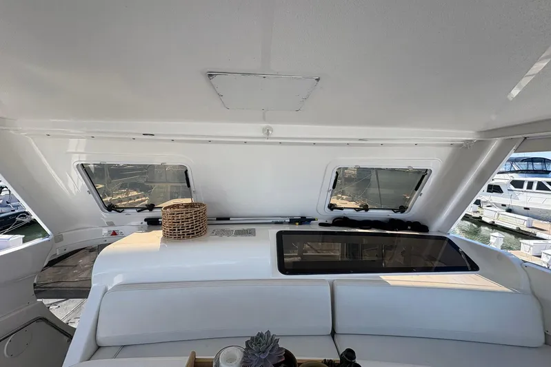 Lola's Ark III Yacht Photos Pics Interior view of a 2001 Silverton 453 Motor Yacht with seating and windows.