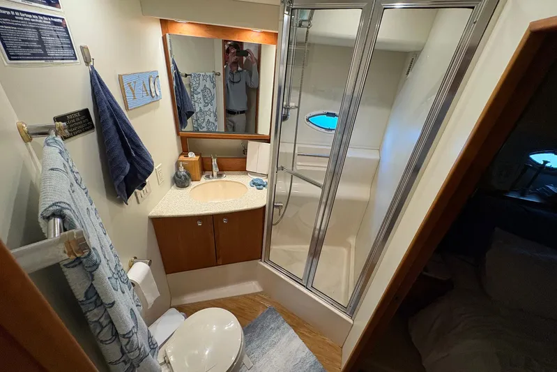 Lola's Ark III Yacht Photos Pics Bathroom interior of 2001 Silverton 453 Motor Yacht with shower and sink.