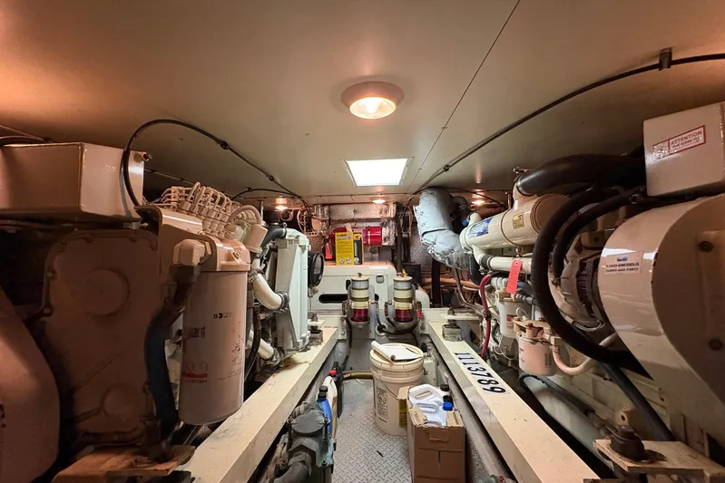 Lola's Ark III Yacht Photos Pics Engine room of a 2001 Silverton 453 Motor Yacht, showcasing machinery and equipment.