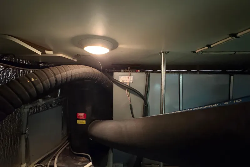 Lola's Ark III Yacht Photos Pics Engine room of a 2001 Silverton 453 Motor Yacht, featuring hoses and wiring.