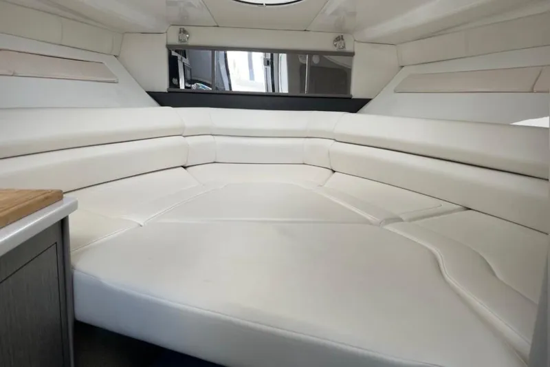  Yacht Photos Pics Interior of 2021 Monterey 295 Sport Yacht with white leather seating and modern design.