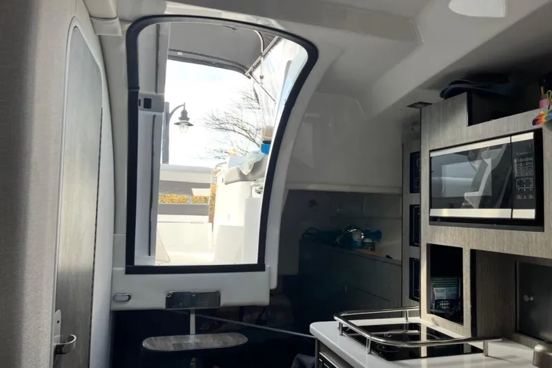  Yacht Photos Pics Interior view of 2021 Monterey 295 Sport Yacht with modern kitchen amenities.