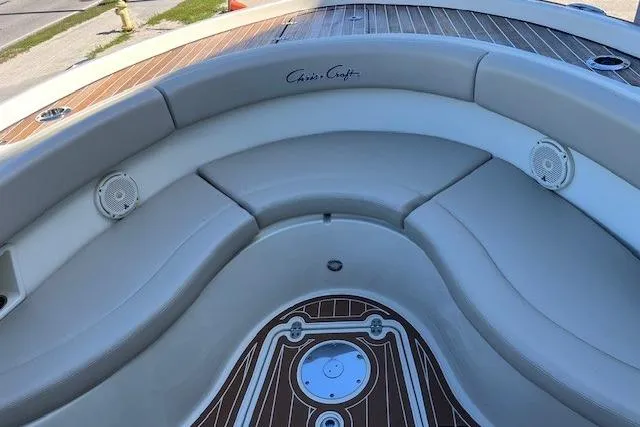  Yacht Photos Pics 2018 Chris-Craft Catalina 30 boat interior with cushioned seating and wood accents.