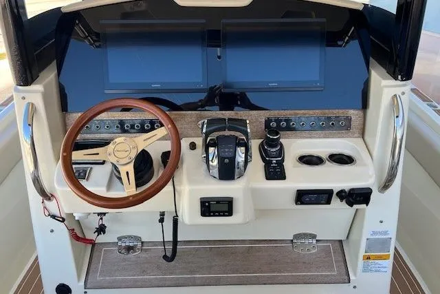  Yacht Photos Pics 2018 Chris-Craft Catalina 30 helm with dual screens and wooden steering wheel.