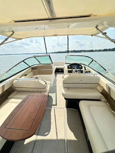  Yacht Photos Pics 2019 Regal 29 OBX boat interior with spacious seating and elegant design on a sunny day.