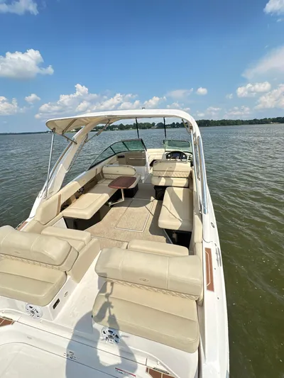  Yacht Photos Pics 2019 Regal 29 OBX boat with spacious seating on a sunny lake.