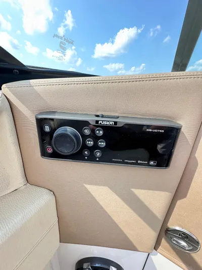  Yacht Photos Pics Fusion audio system on 2019 Regal 29 OBX boat, under a clear blue sky.
