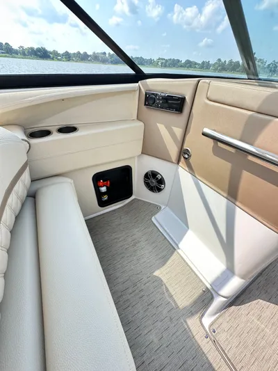  Yacht Photos Pics Interior of 2019 Regal 29 OBX boat with beige seating and control panel.