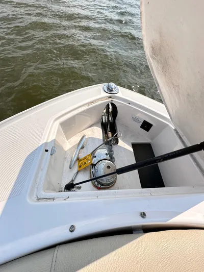  Yacht Photos Pics 2019 Regal 29 OBX boat anchor compartment with open hatch on water.