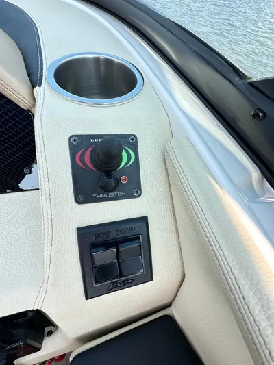  Yacht Photos Pics Control panel of a 2019 Regal 29 OBX boat with joystick and cup holder.
