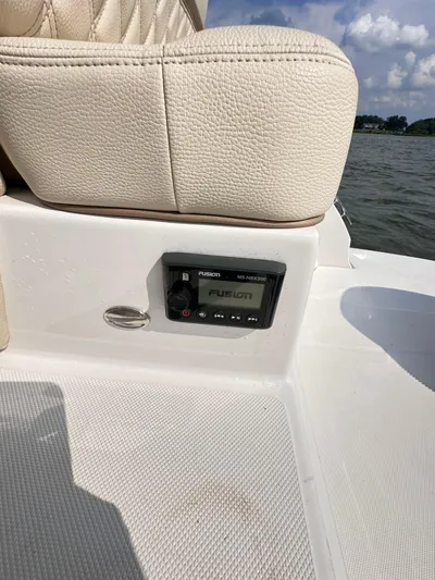  Yacht Photos Pics 2019 Regal 29 OBX boat interior with Fusion audio system by the water.