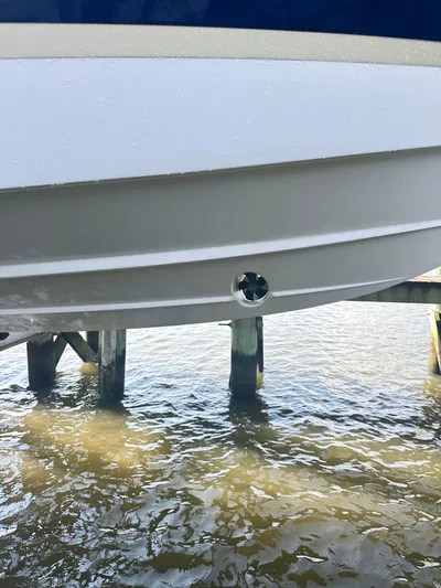  Yacht Photos Pics 2019 Regal 29 OBX boat hull above water near dock.