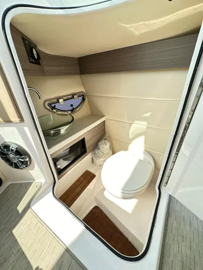  Yacht Photos Pics 2019 Regal 29 OBX boat interior bathroom with sink and toilet.