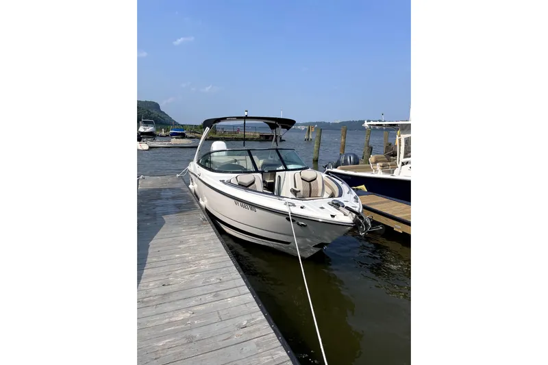  Yacht Photos Pics 2023 Monterey 275SS Super Sport boat docked at a marina on a sunny day.