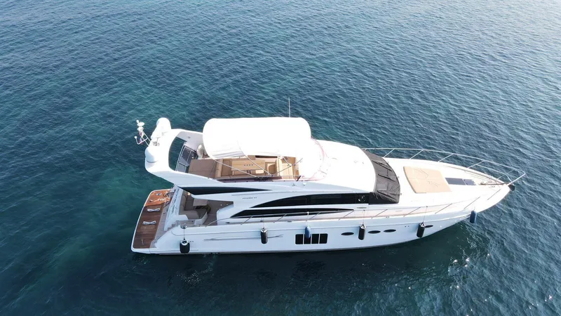  Yacht Photos Pics Luxury yacht Princess 64 FLY 2012 cruising on clear blue water.