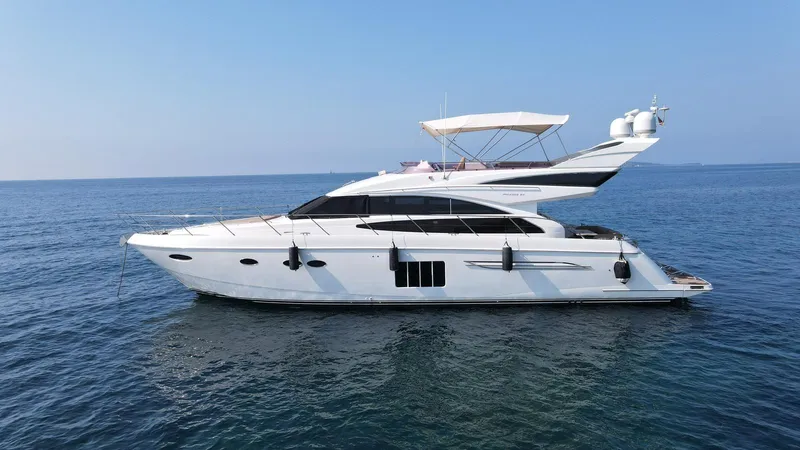  Yacht Photos Pics Luxury 2012 Princess 64 FLY yacht cruising on open sea.