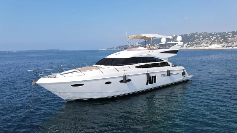  Yacht Photos Pics Luxury 2012 Princess 64 FLY yacht on calm blue sea.