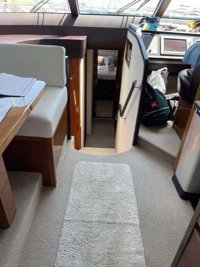  Yacht Photos Pics Interior view of 2012 Princess 64 FLY yacht, featuring stairs and seating area.