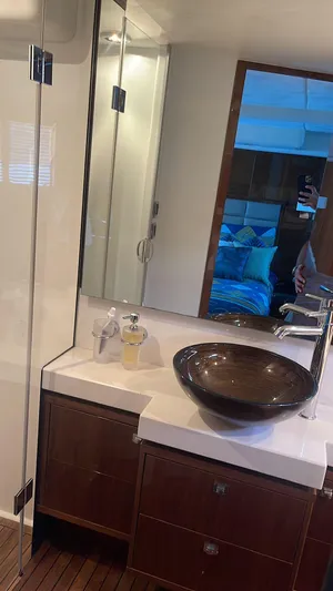  Yacht Photos Pics Luxurious bathroom in 2012 Princess 64 FLY yacht with modern sink and mirror.