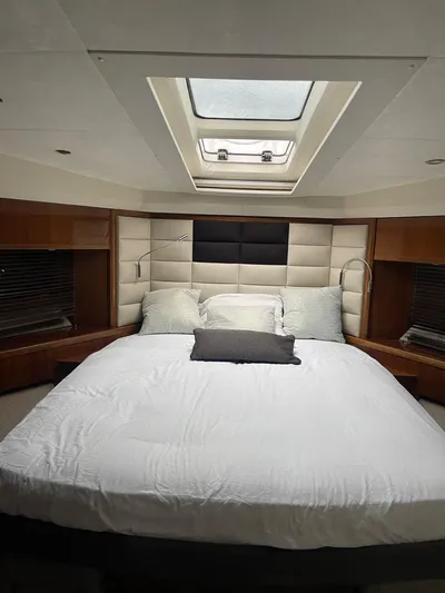  Yacht Photos Pics Luxurious bedroom interior of 2012 Princess 64 FLY yacht with skylight and modern design.