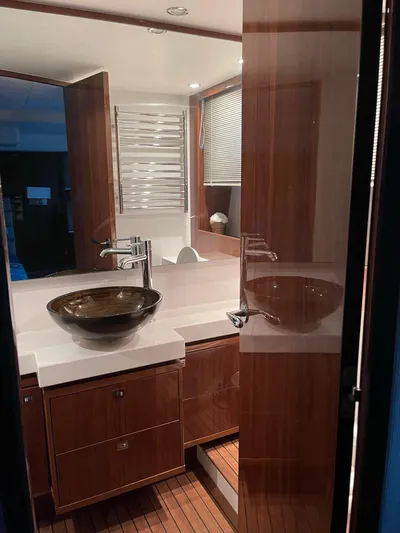  Yacht Photos Pics Luxurious bathroom interior of 2012 Princess 64 FLY yacht with modern fixtures.