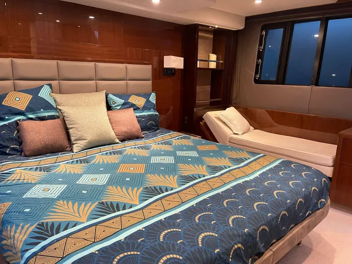  Yacht Photos Pics Luxurious bedroom interior of 2012 Princess 64 FLY yacht with elegant bedding and seating.