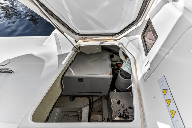  Yacht Photos Pics Engine compartment of 2017 Leopard 43 Powercat, showcasing mechanical components and storage area.