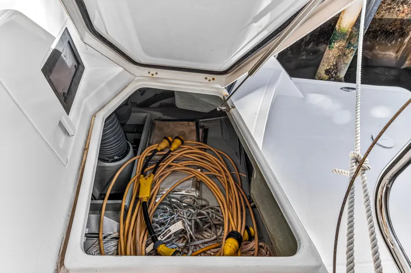  Yacht Photos Pics Open storage compartment on 2017 Leopard 43 Powercat with cables and ropes inside.
