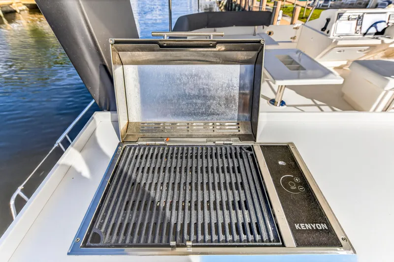  Yacht Photos Pics Outdoor grill on 2017 Leopard 43 Powercat yacht deck, near water.