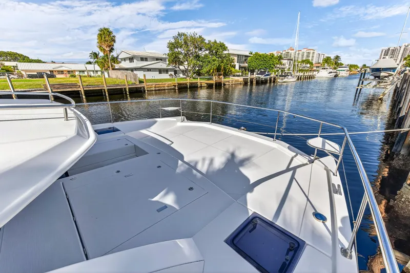 Yacht Photos Pics Leopard 43 Powercat 2017 yacht docked in a serene marina setting.