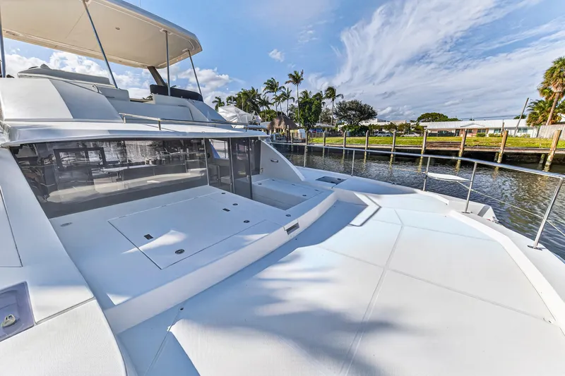  Yacht Photos Pics 2017 Leopard 43 Powercat yacht docked by a scenic waterfront.