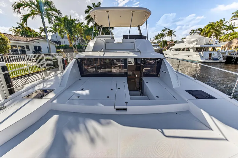  Yacht Photos Pics 2017 Leopard 43 Powercat yacht docked, featuring spacious deck and modern design.