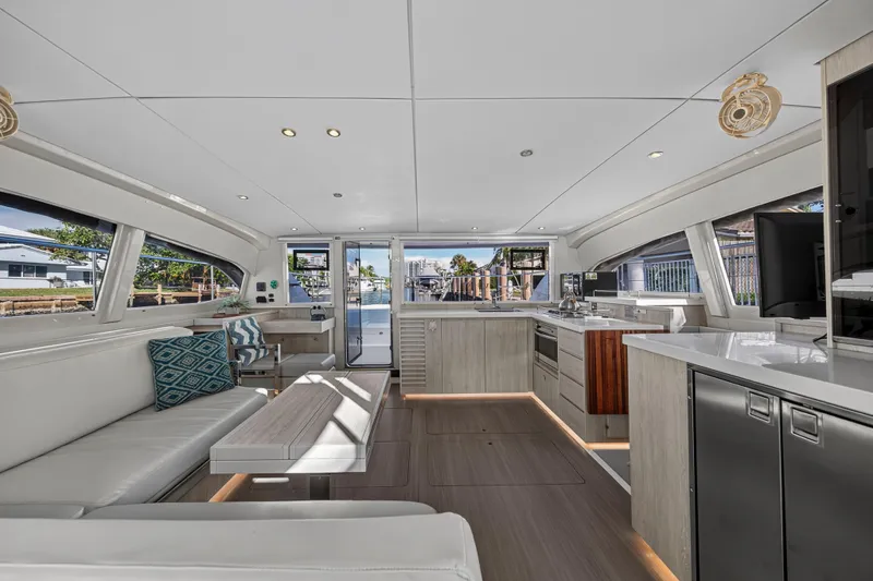  Yacht Photos Pics Luxurious interior of 2017 Leopard 43 Powercat yacht with modern kitchen and seating area.