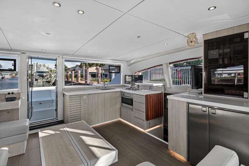  Yacht Photos Pics Interior of 2017 Leopard 43 Powercat yacht with modern kitchen and scenic water view.