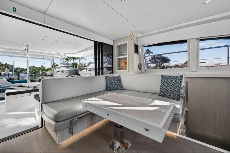  Yacht Photos Pics Interior of 2017 Leopard 43 Powercat yacht with modern seating and table.
