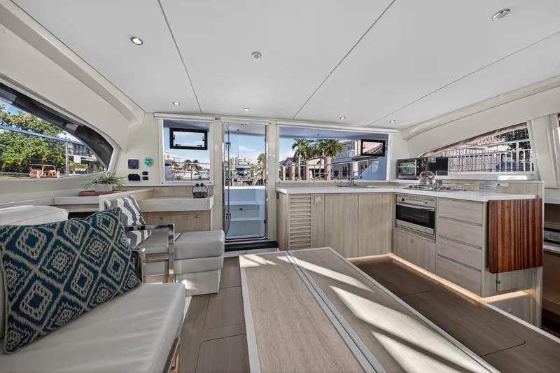  Yacht Photos Pics Interior of 2017 Leopard 43 Powercat yacht, featuring modern kitchen and seating area.