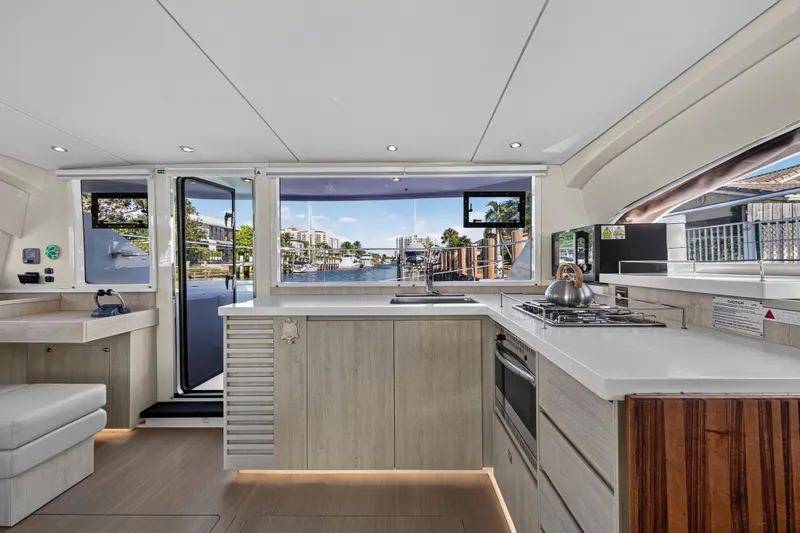  Yacht Photos Pics Modern kitchen interior of 2017 Leopard 43 Powercat yacht with waterfront view.