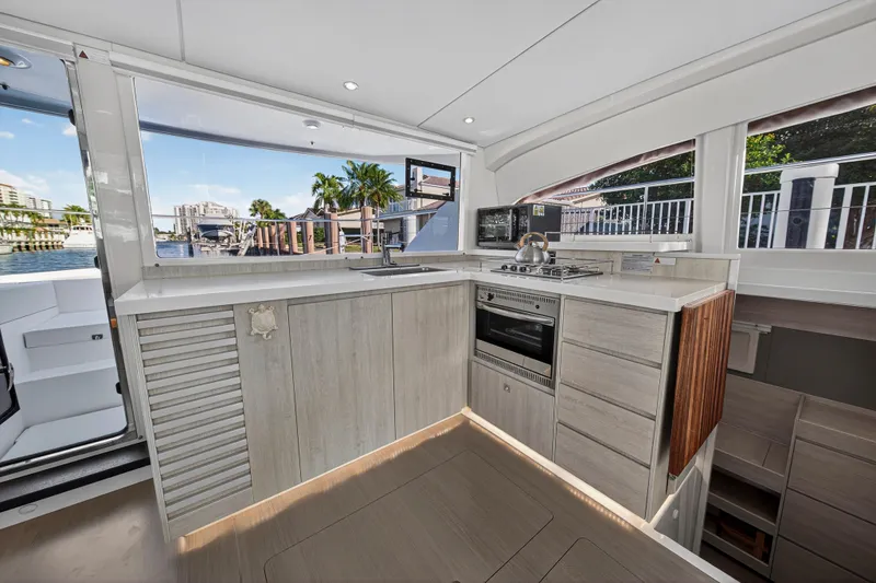  Yacht Photos Pics Modern kitchen interior of 2017 Leopard 43 Powercat yacht with sleek design and appliances.