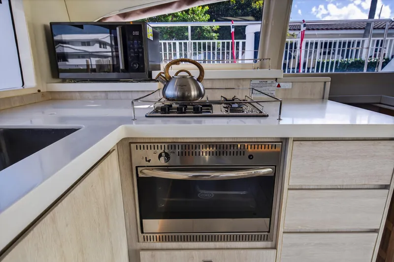  Yacht Photos Pics Modern kitchen in 2017 Leopard 43 Powercat with stove, oven, and microwave.