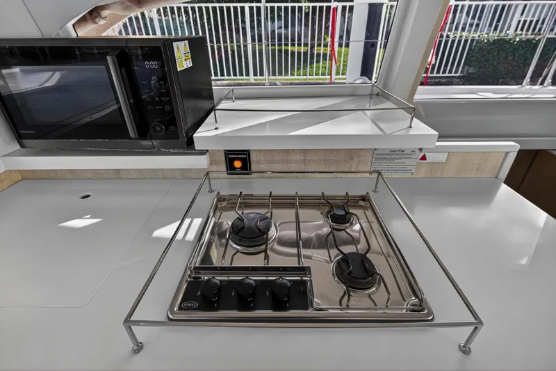  Yacht Photos Pics Kitchen area of 2017 Leopard 43 Powercat with stove and microwave.